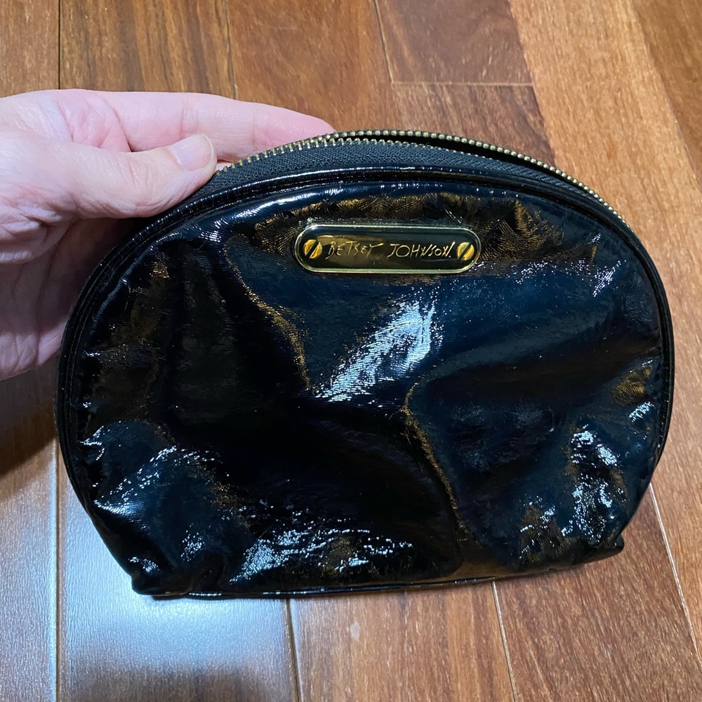 Betsey Johnson black makeup bag.